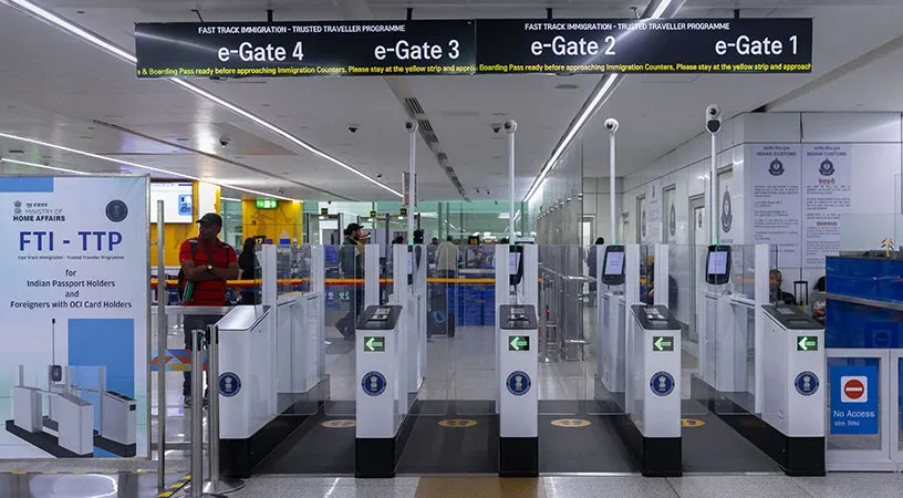 Automated immigration e-gates in an airport terminal for trusted travelers.