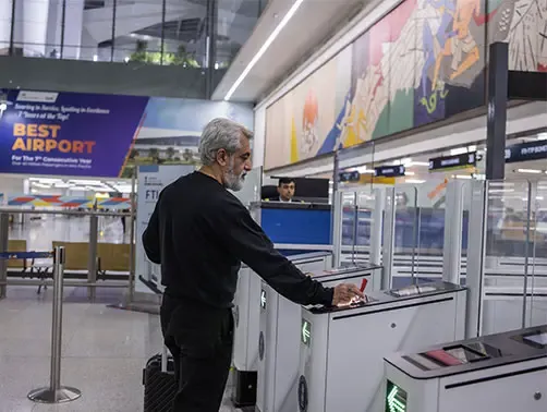 Automated immigration e-gates in an airport terminal for trusted travelers.
