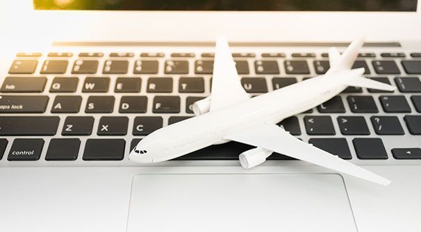 Airplane on laptop keyboard