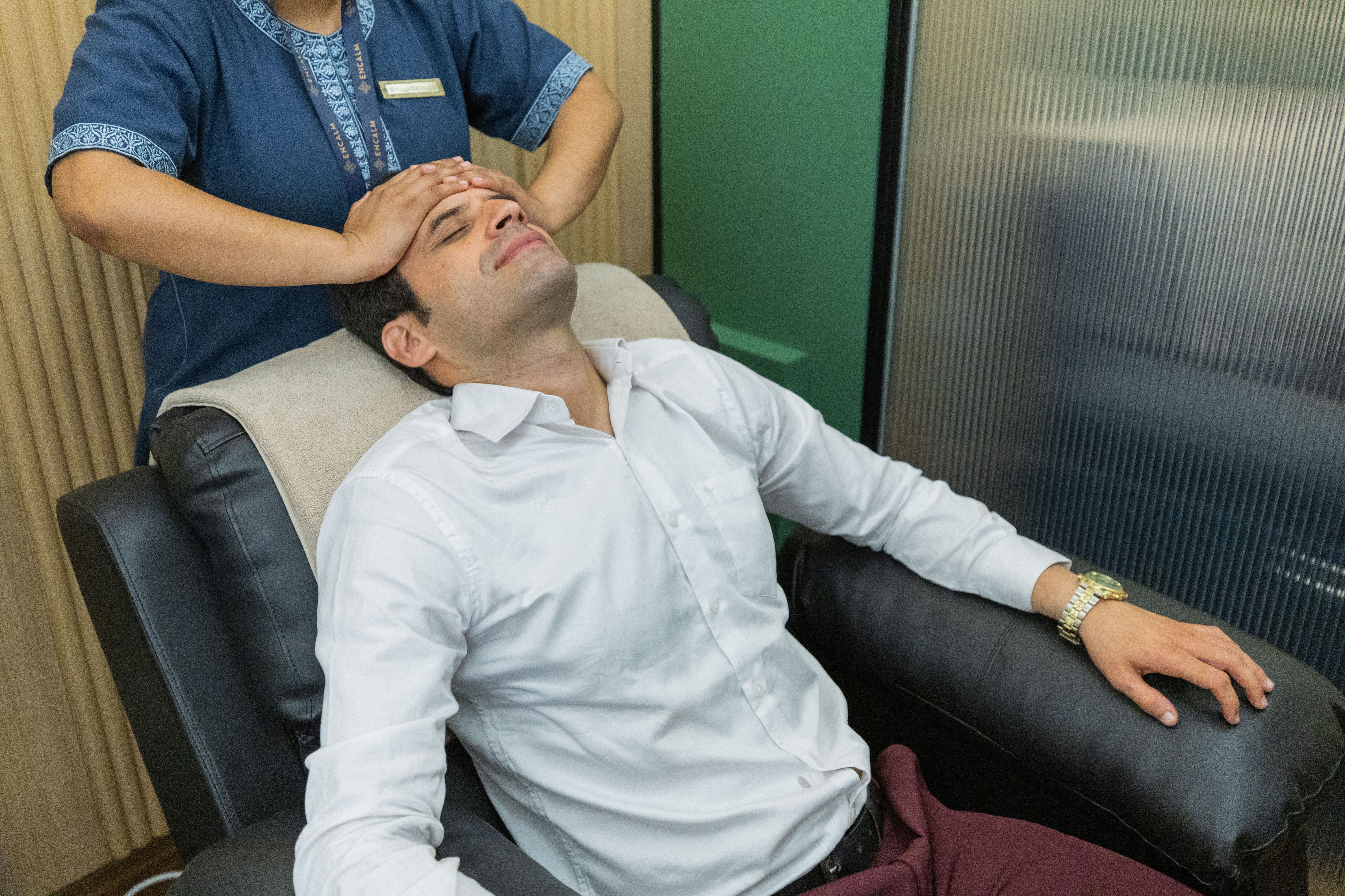 Guest receiving a head massage.