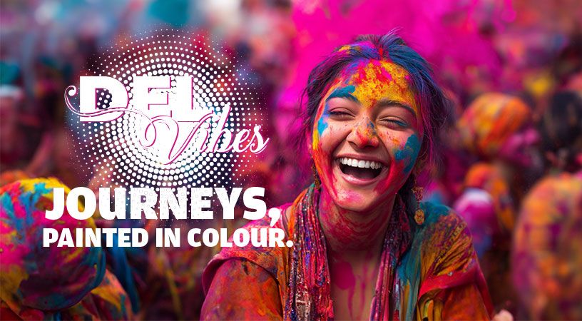 Girl smiling in the picture filled with holi color
