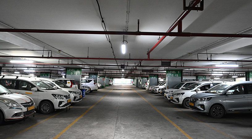 Airport parking area with parked cars