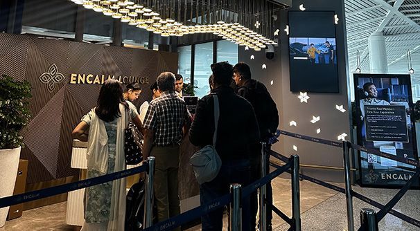 People queuing at Encalm lounge entrance